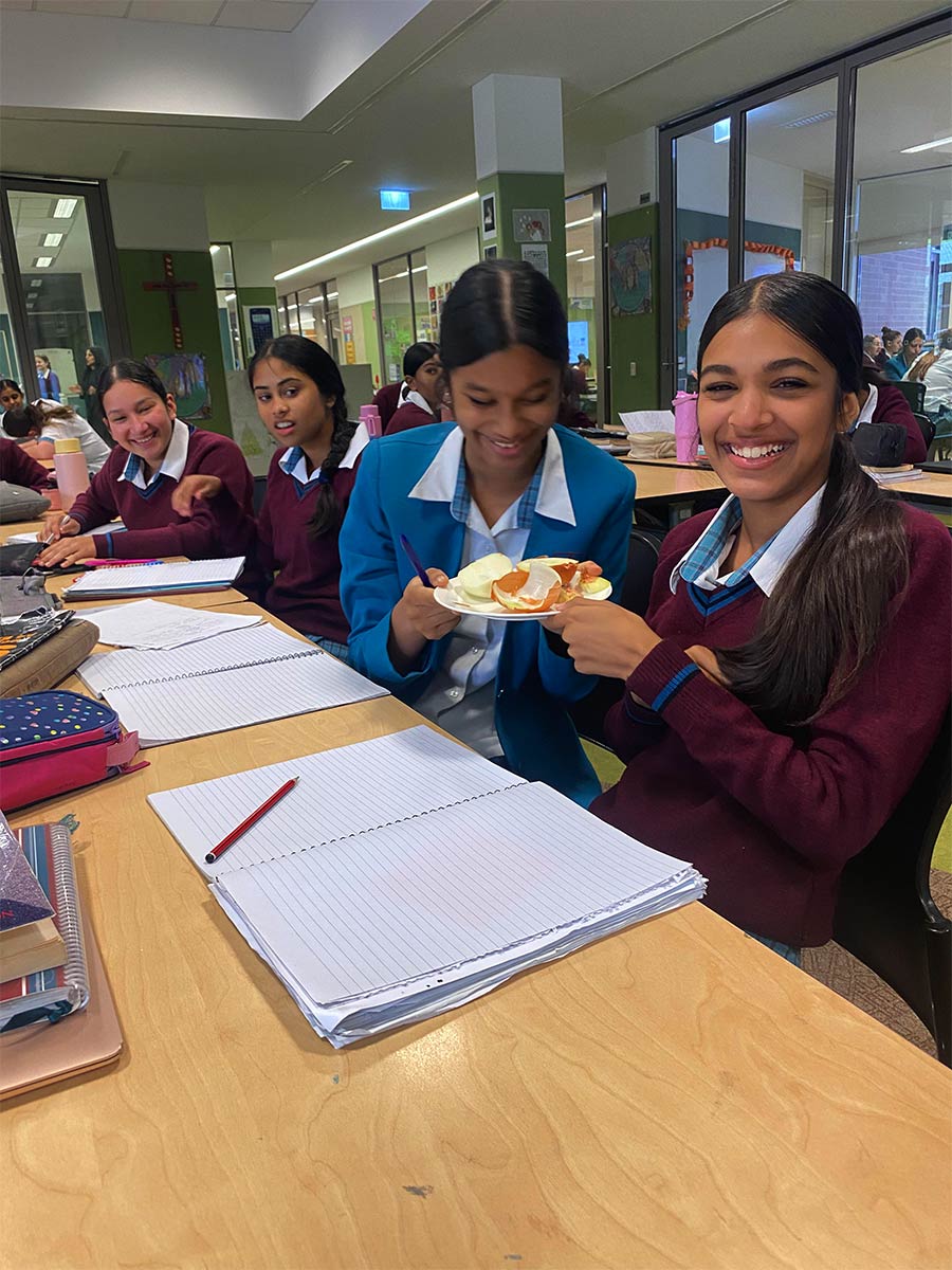 Year 8 English students with holding onions