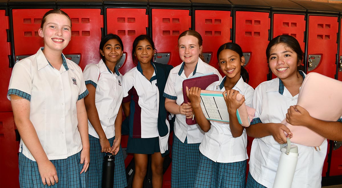 Catherine McAuley Westmead Year 7 students standing by their new lockers
