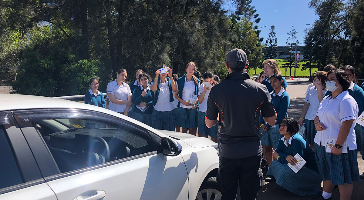 Catherine McAuley Students gathered around at the Rotary Youth Driver Awareness (RYDA) Program