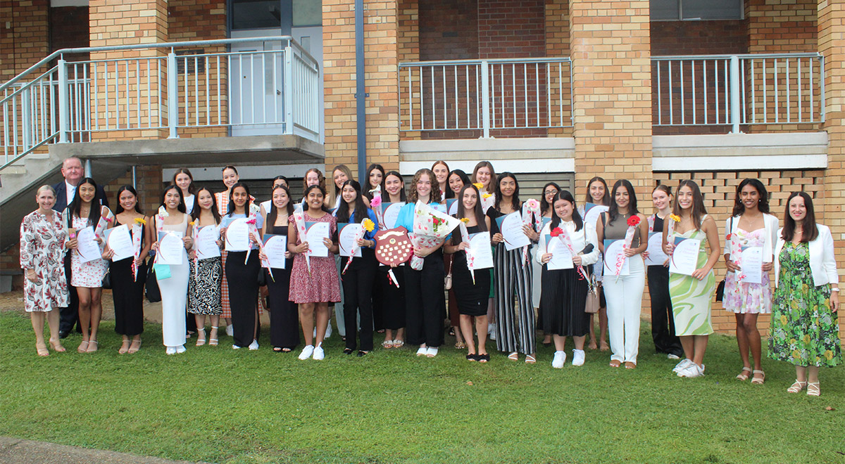 McAuley Westmead High Achievers and School Dux standing outside