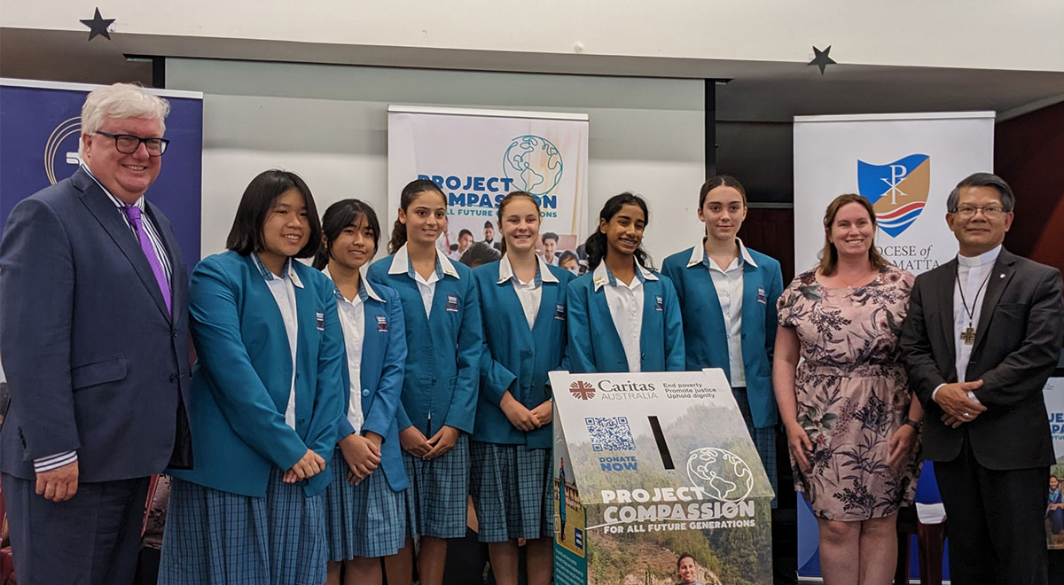 Year 9 students and Assistant Leader of Formation and Mission Ms McGlone with Mr Groot, CSPD Executive Director and Most Rev Vincent Long OFM Conv, Bishop of Parramatta, at the Project Compassion launch.