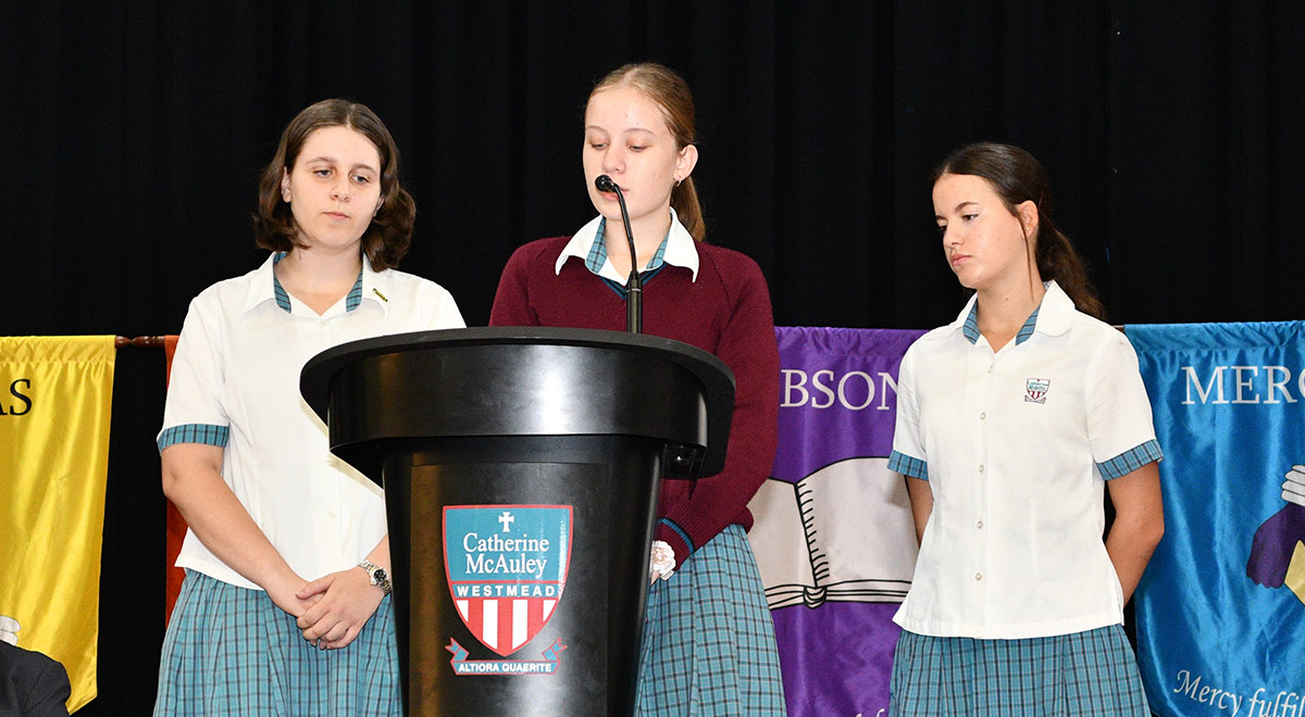 Year 9 students announcing the winners of the Books Over the Break competition