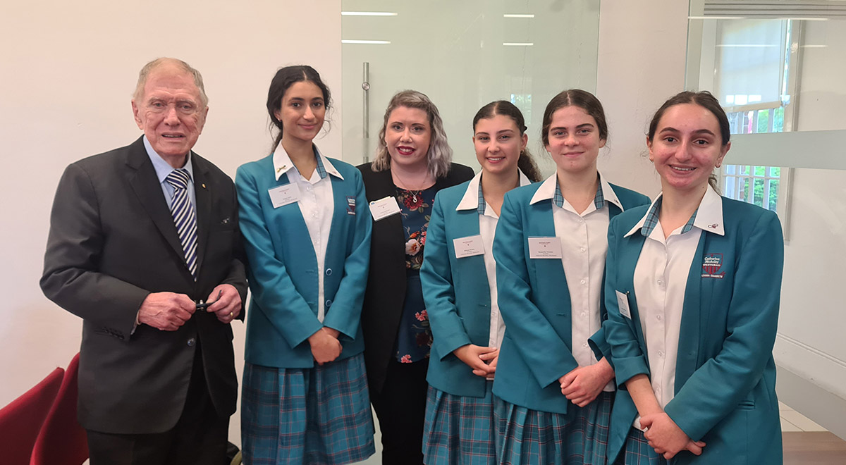 The Year 11 Legal Studies Team who placed as Runners Up in the Kirby Cup with teacher Miss Spelman and The Hon Michael Kirby.