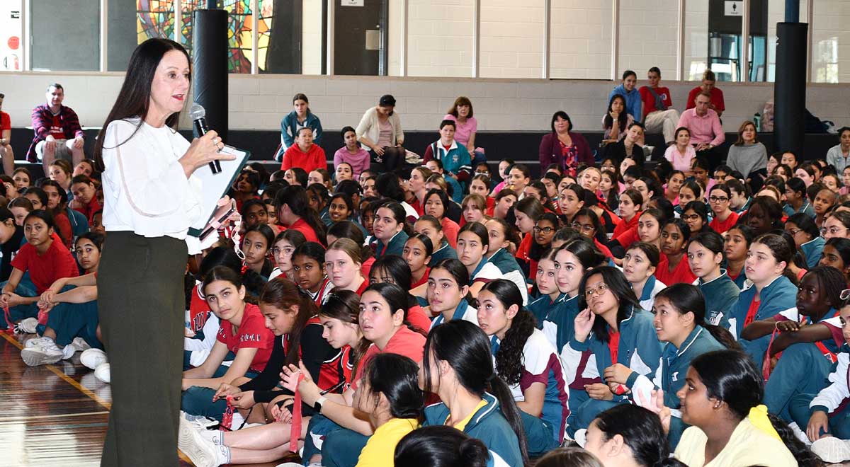 School Principal Ms Mary Refalo announcing the winners of the House Cheer Competition to the school community.