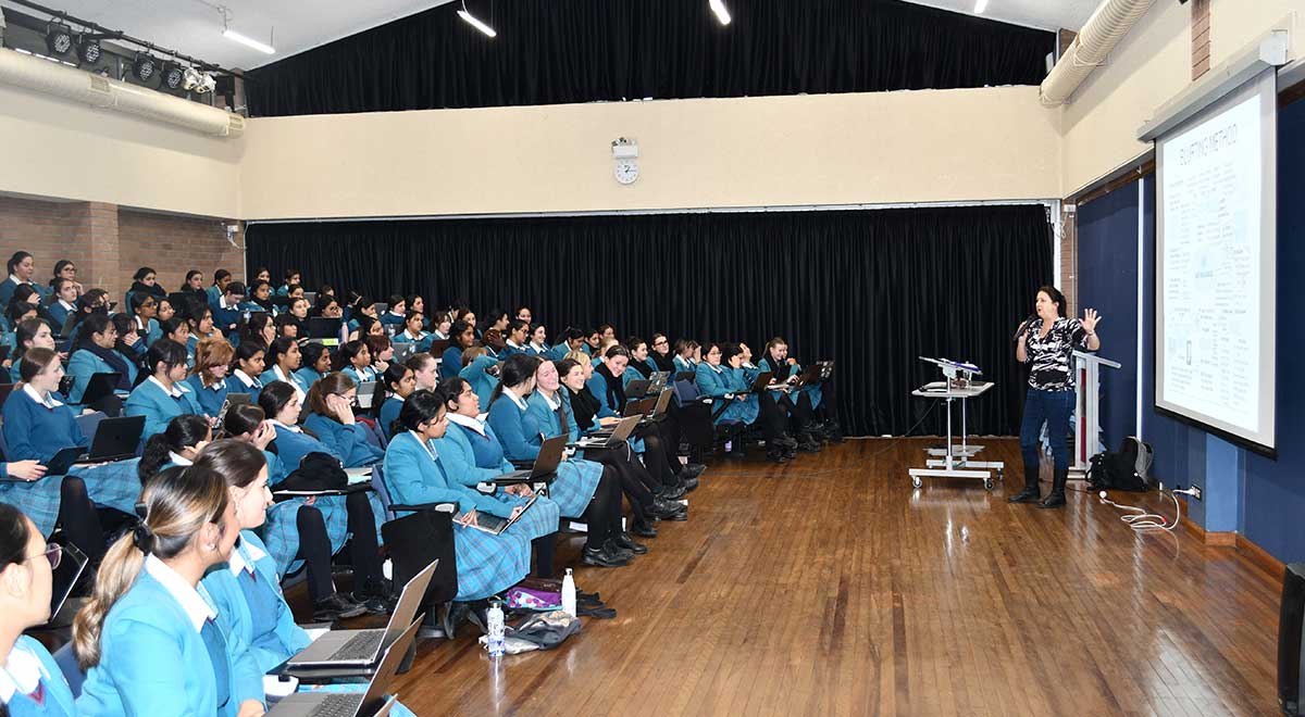 Catherinee McAuley Westmead students posing for a photo with Dr Prue Salter