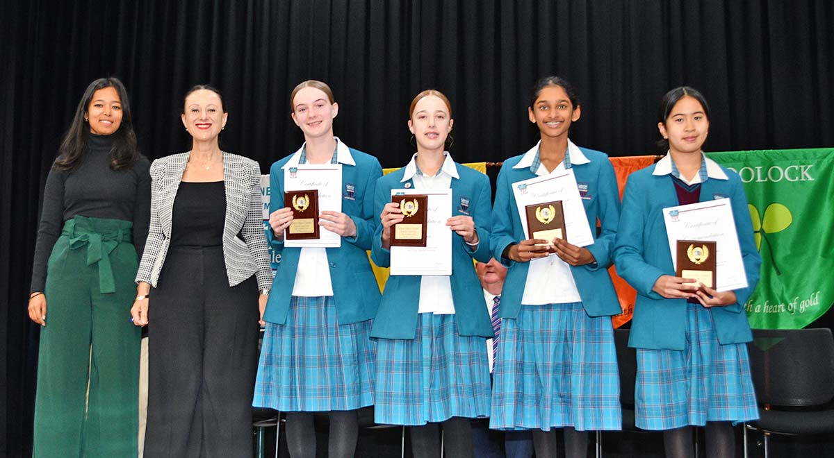 Yr 7 Debating students with coach Miss Raja and Principal Ms Refalo