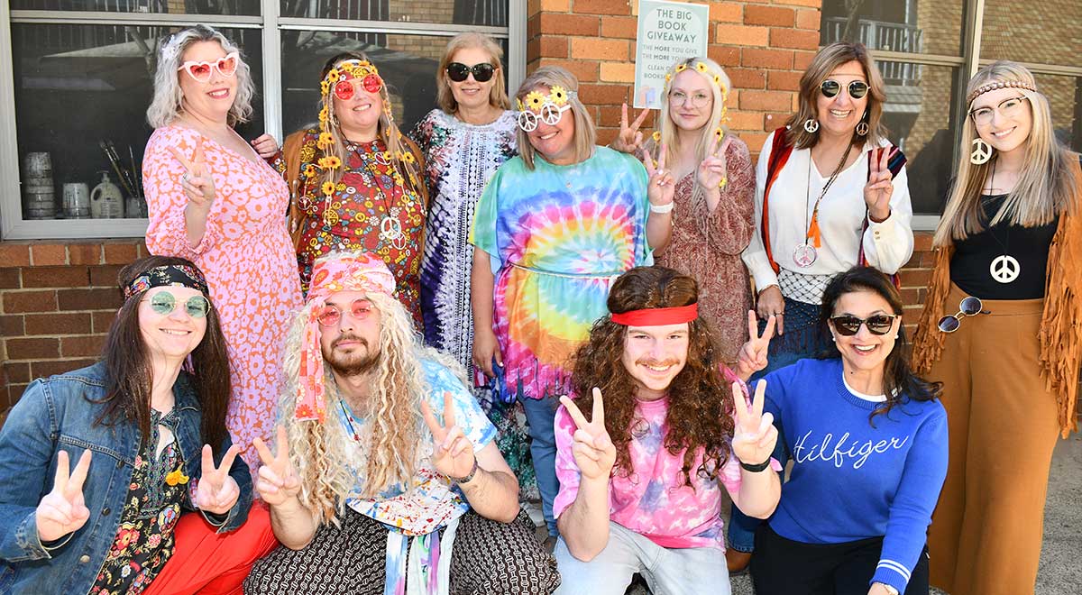 The Catherine McAuley Westmead Social Science Department dressed in outfits from the 1970s