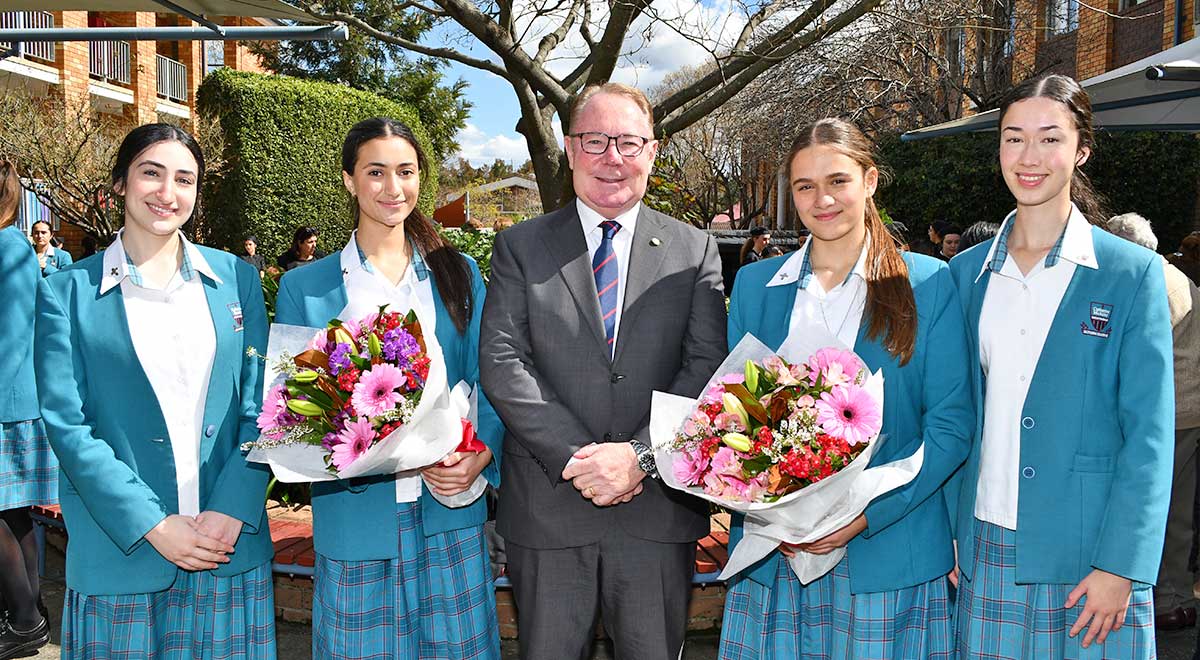 Dr Hugh McDermott MP State Member for Prospect with the incoming and outgoing school captains.