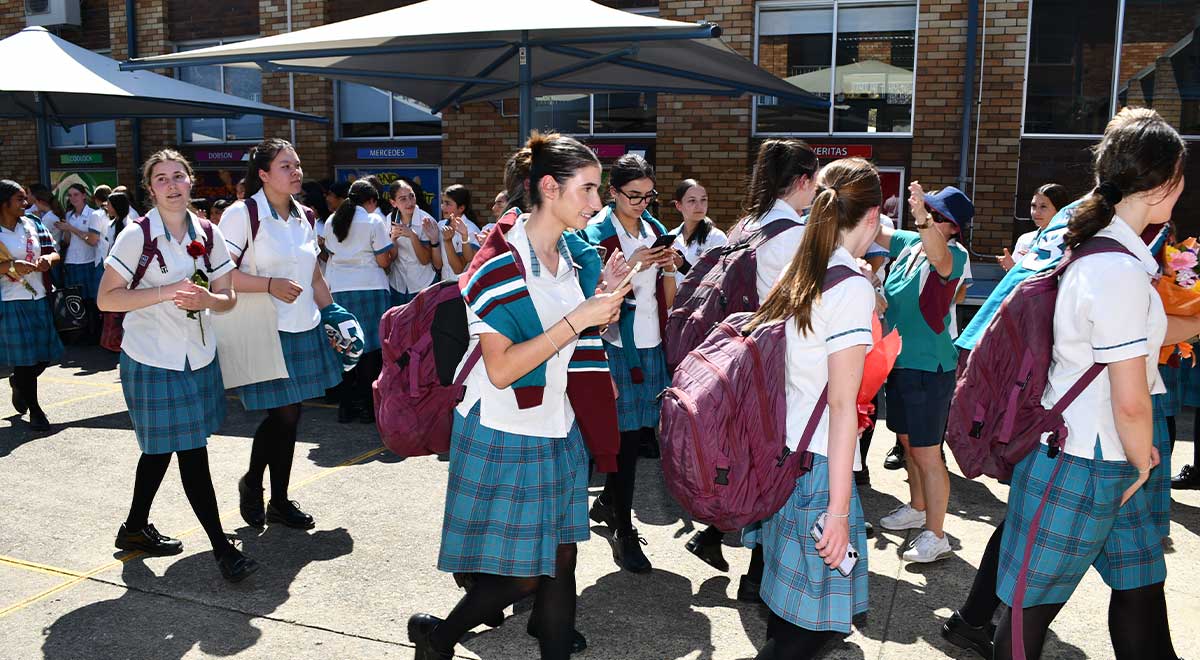 Year 12 students are clapped out of the school for the last time