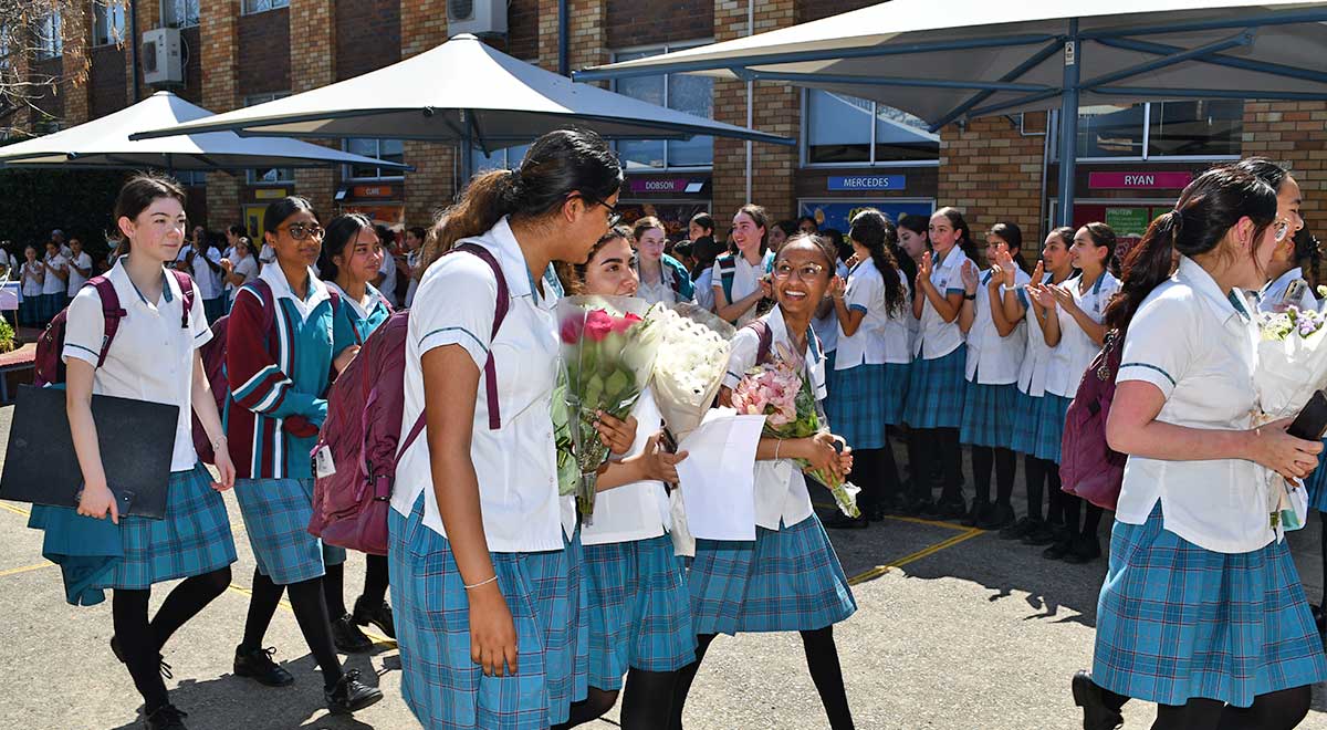 Year 12 students are clapped out of the school for the last time