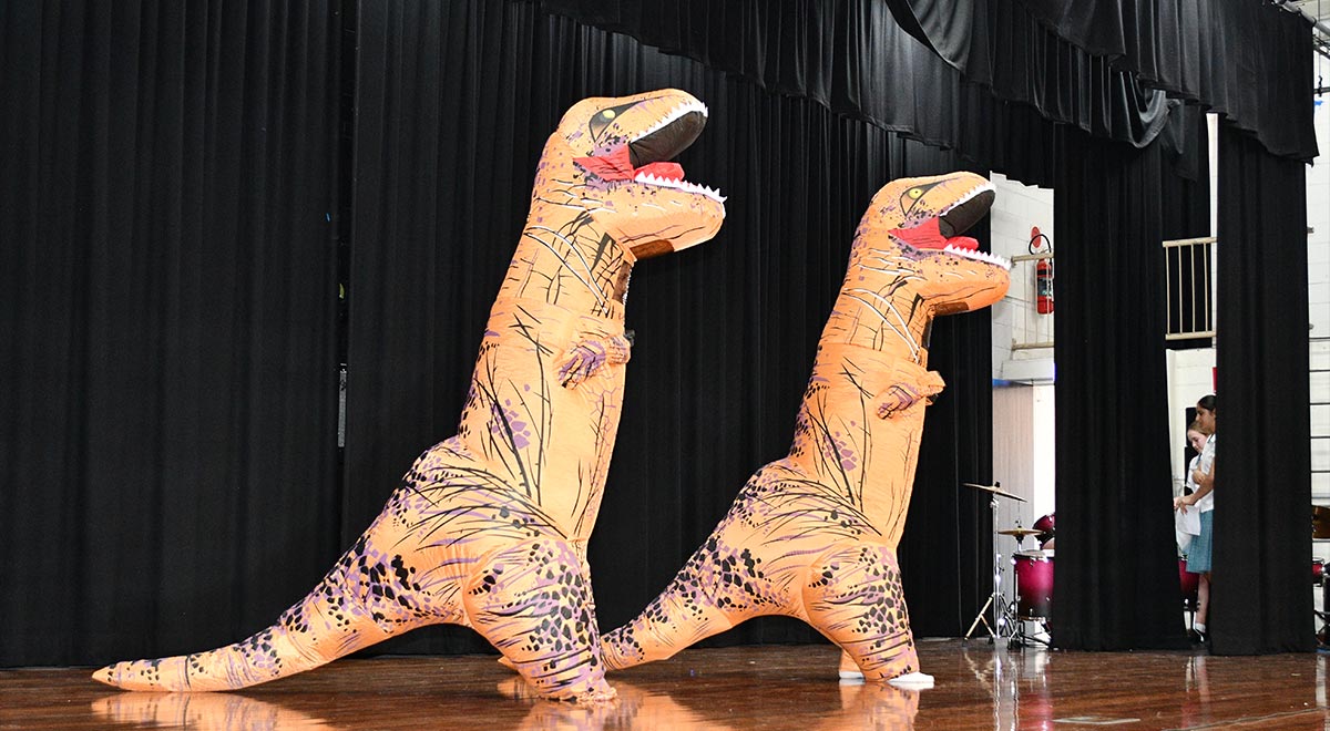 Year 8 students Charlotte and Annabel performing 'Dino-Rock' at the McAuley's Got Talent event