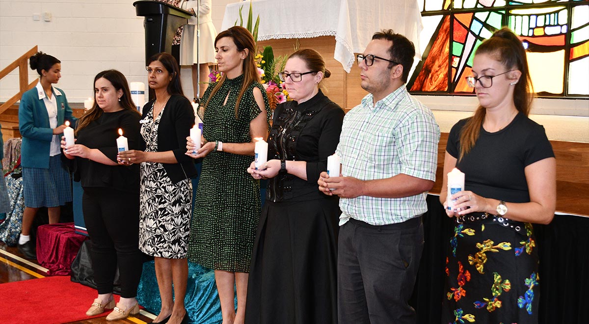 New staff were commissioned at the Opening School Mass and received a staff candle