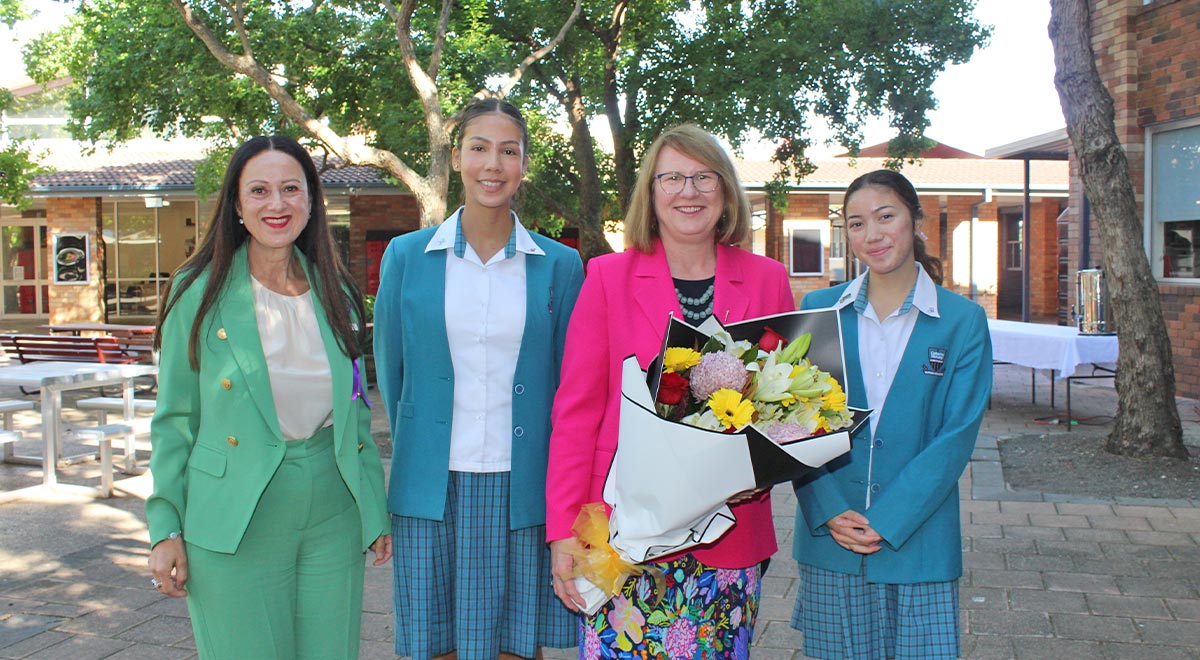 Ms Donna Davis MP addressed the school's special IWD assembly, as did the Student Social Justice Leaders Mikaela and Isabella, shown here with Ms Davis and School Principal Mary Refalo.