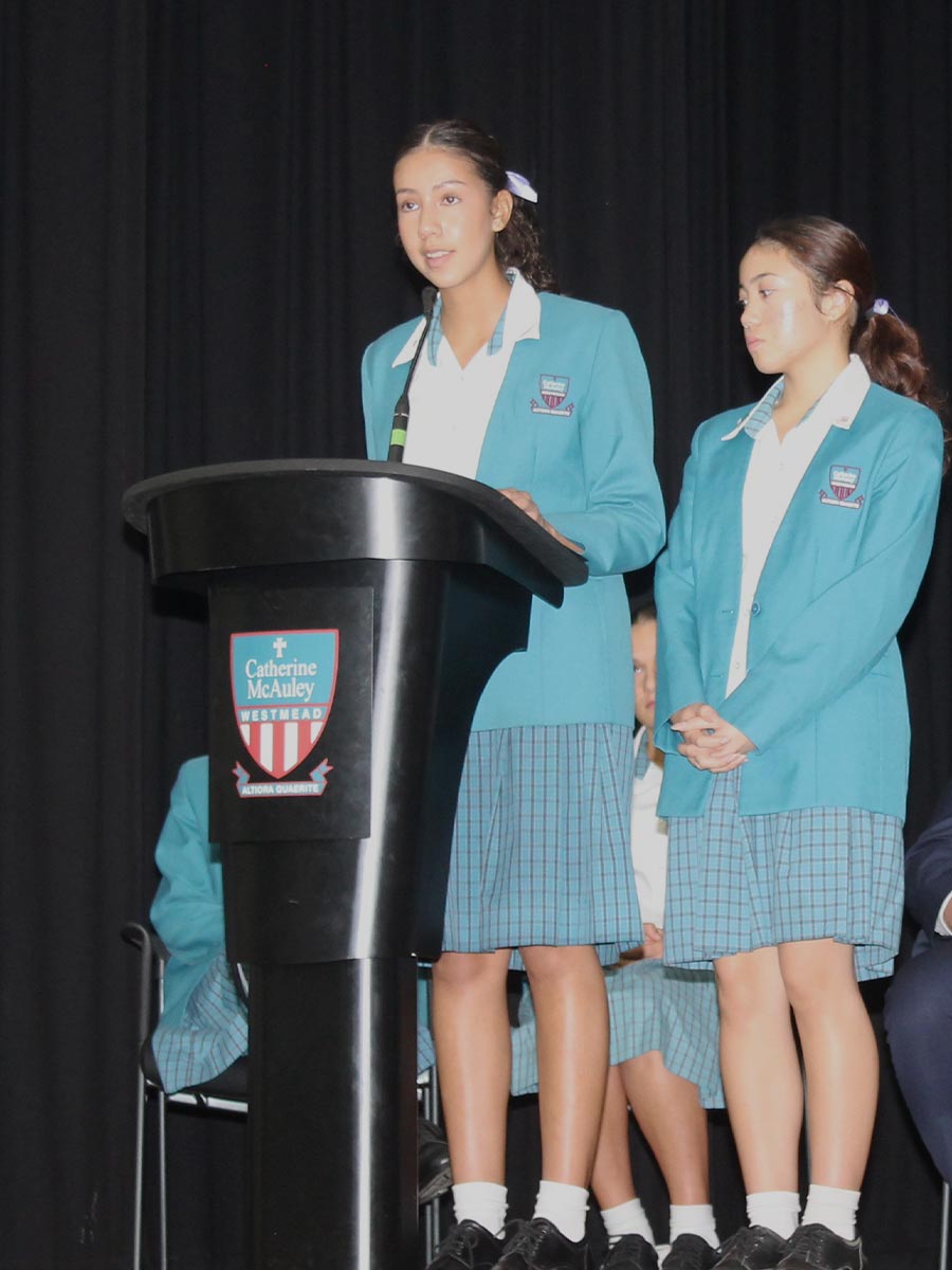 Social Justice Leaders Mikaela and Isabella speaking at the IWD assembly
