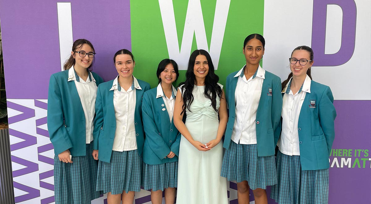 Catherine McAuley Westmead Students with Dr Rhonda Itaoui, Director of the Centre for Western Sydney, at the City of Parramatta IWD event.