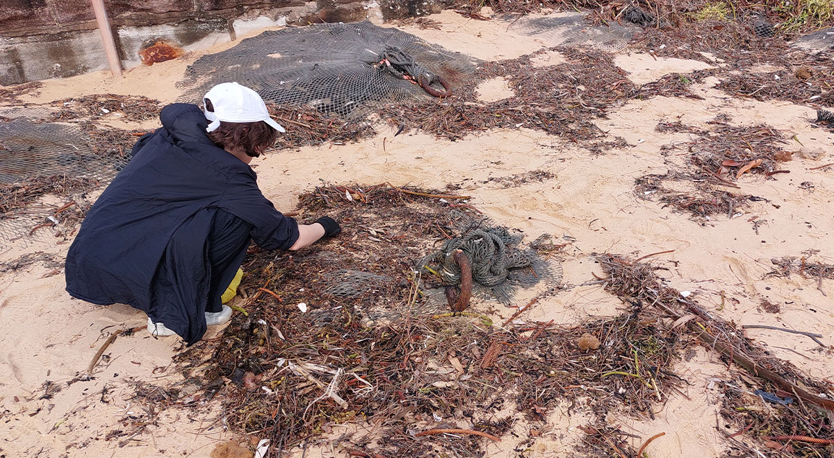 Catherine McAuley Westmead student cleaning up beach