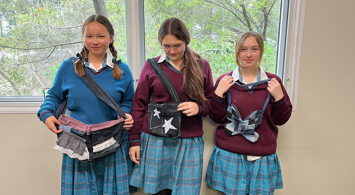 Catherine McAuley Westmead students holding their sustainable fashion