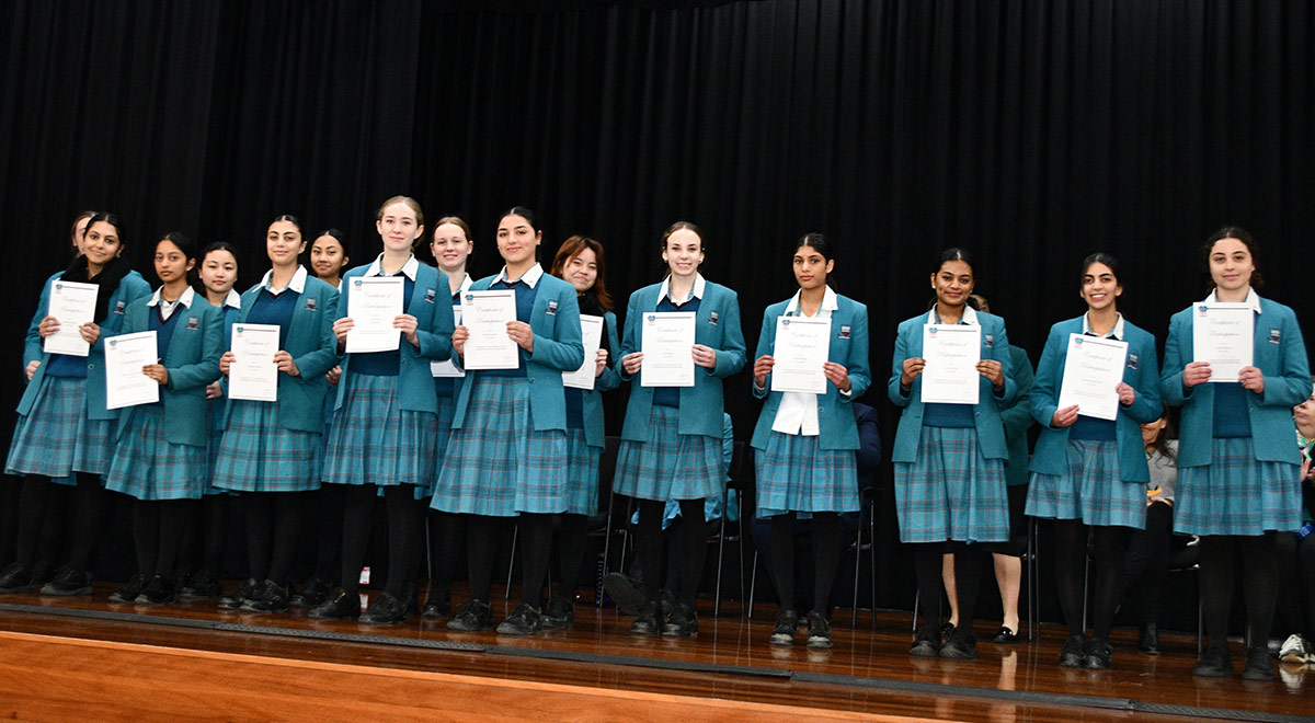 Catherine McAuley Westmead students posing with awards in school hall