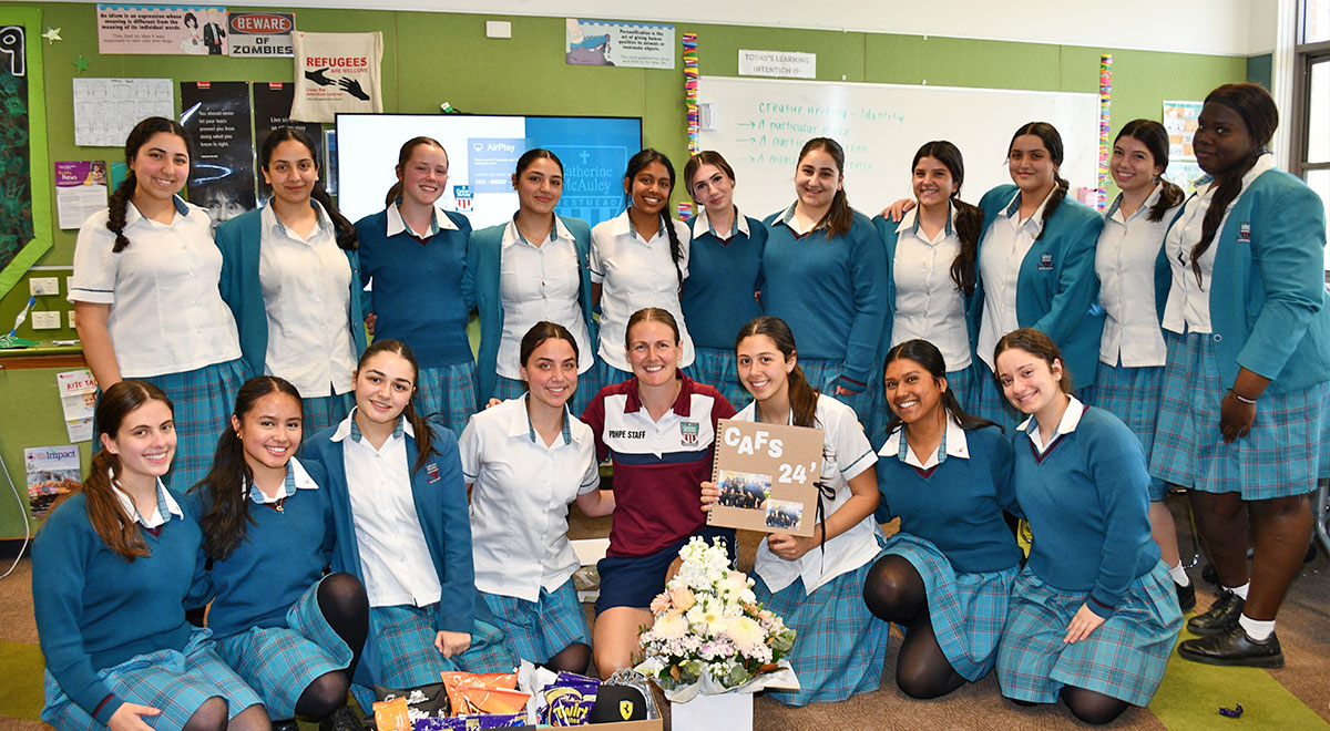 Students giving gifts to Cafs teacher