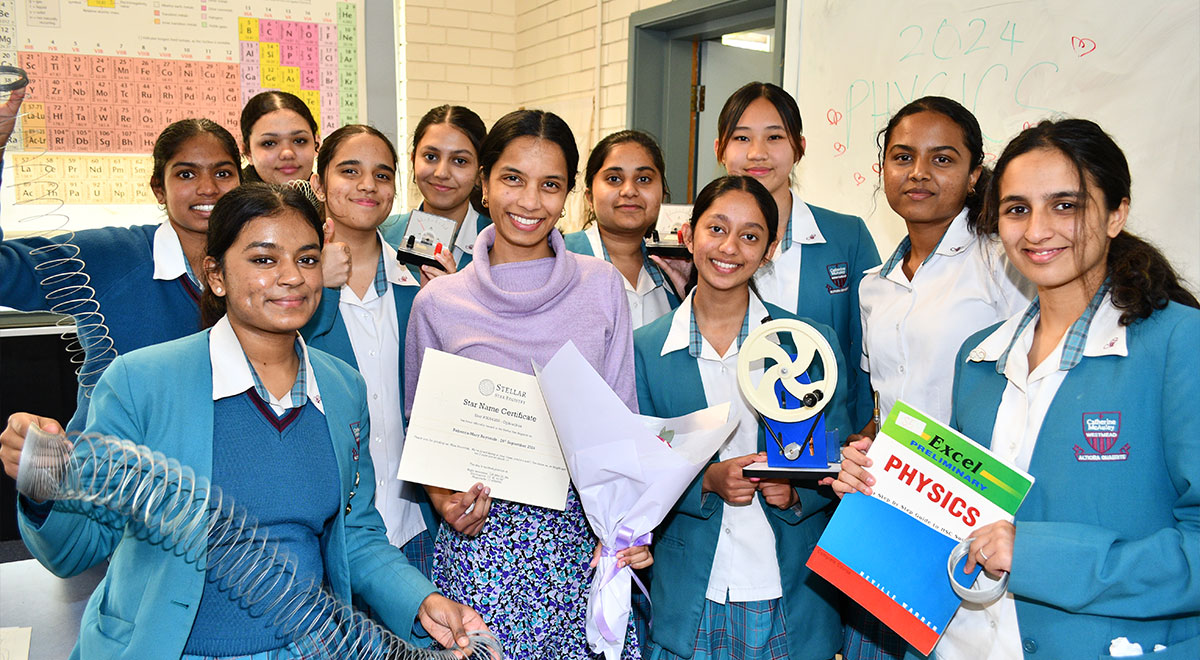 McAuley Westmead students giving teacher flowers