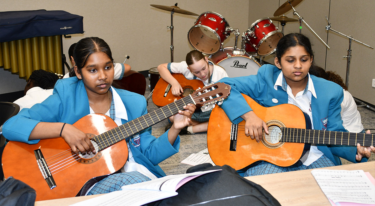 Catherine McAuley Westmead students rocking on on acoustic guitar