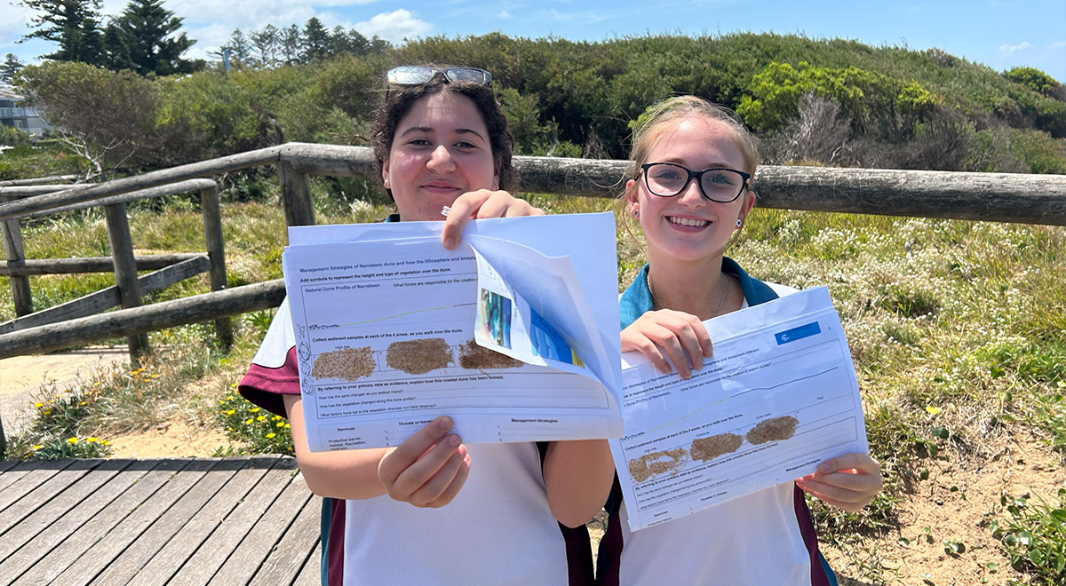 Catherine McAuley Westmead students holding worksheets