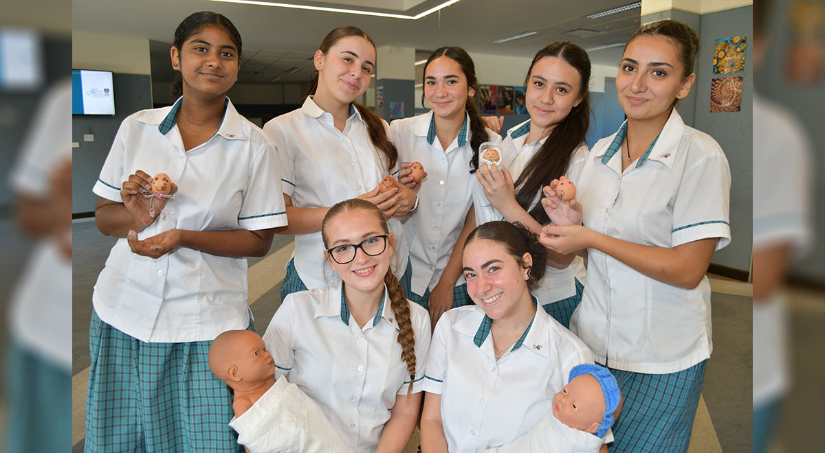 Catherine McAuley Westmead EEC students holding their egg babies
