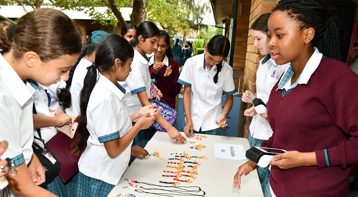 Catherine McAuley Westmead students selling bracelets and lanyards