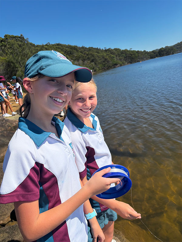 Year 8 Catherine McAuley Westmead students hand reel fishing at the Manly Dam Reservoir.