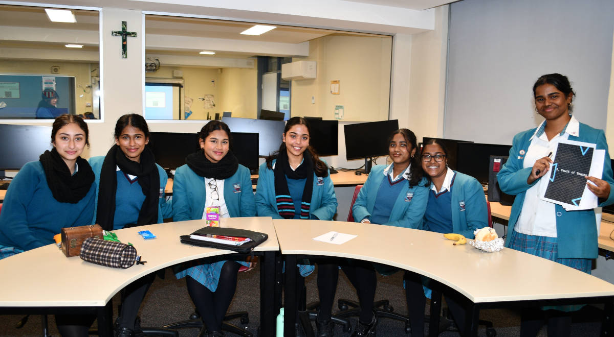  Student Leader of Technology Ann C. with students ready to start the mathematical escape room on Wednesday.