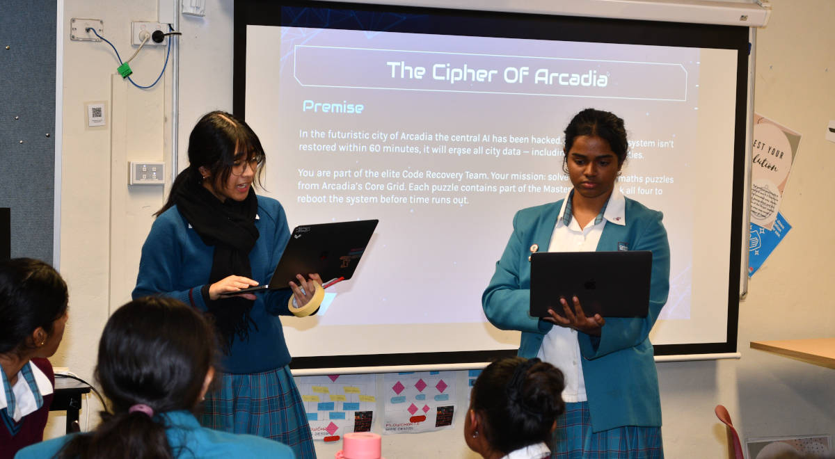 Assistant Technology Leader Cyrille R. gives students instructions at the mathematical escape room.