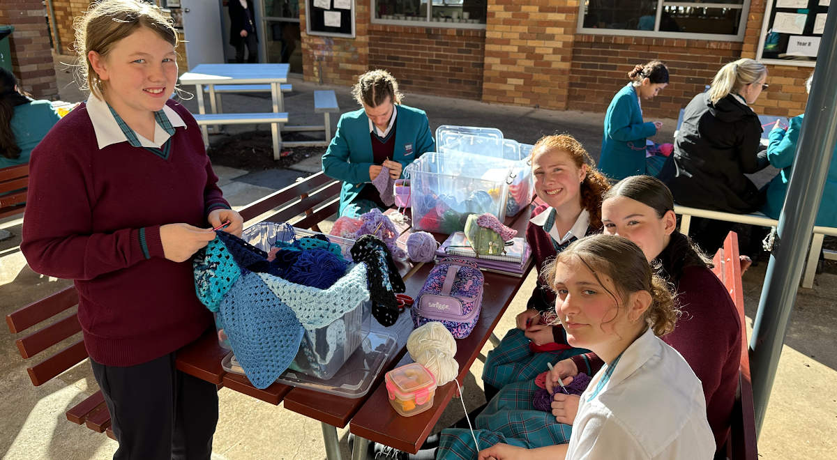 Blankets and gloves made by the Charity Crochet Group for donation to the Parramatta Women's Shelter.