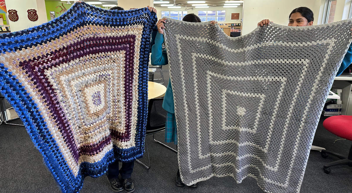 Two of the blankets made by the Charity Crochet Group for donation to the Parramatta Women's Shelter.