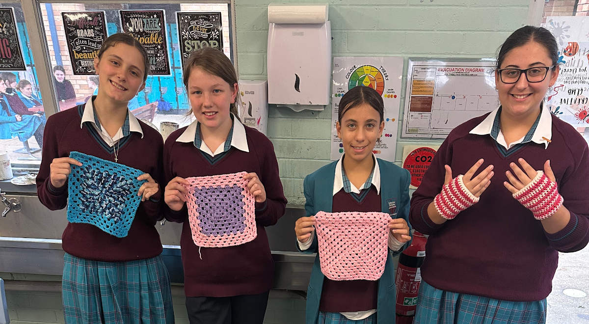 Blankets and gloves made by the Charity Crochet Group for donation to the Parramatta Women's Shelter.