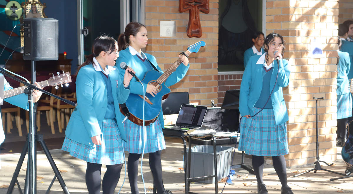 Catherine McAuley Westmead students playing guitar