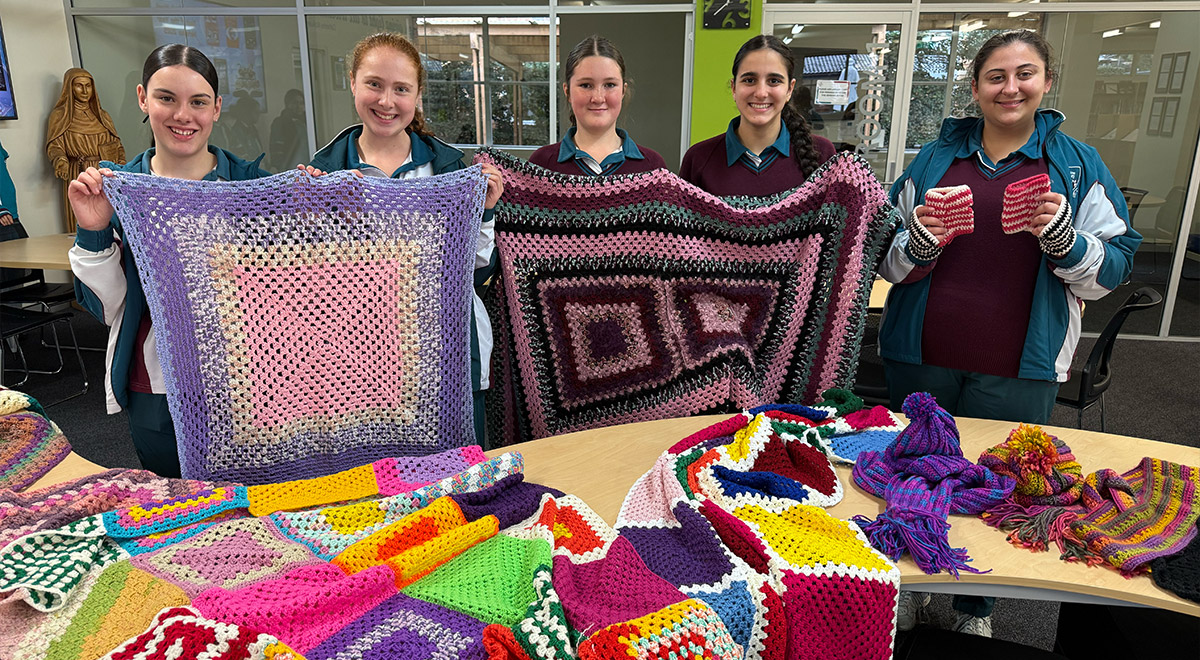 Crochet Club students with some of the items made this winter for charity.