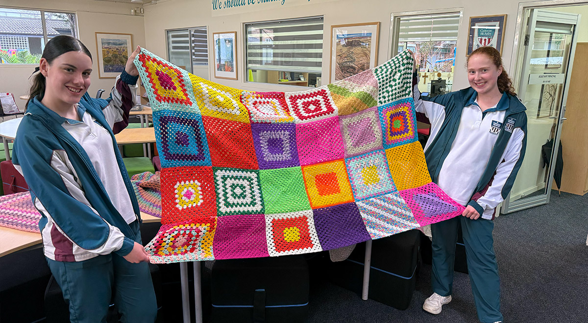 Crochet Club students with some of the items made this winter for charity.