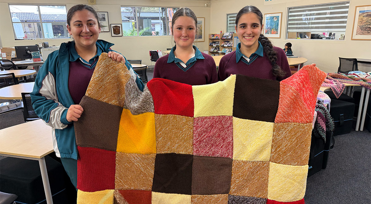Crochet Club students with some of the items made this winter for charity.