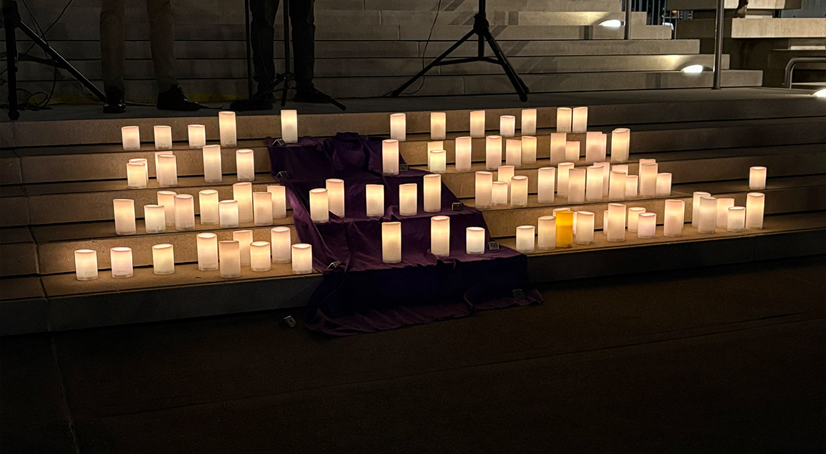 Remembering those who died with a candle tribute