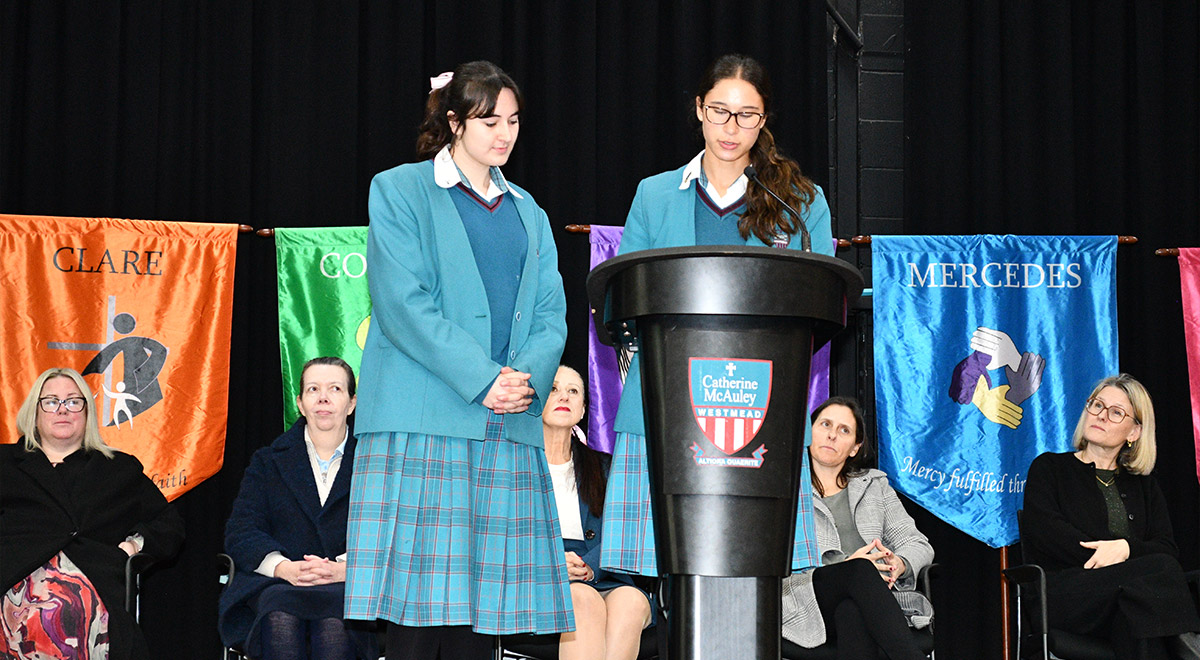 Catherine McAuley Westmead Liturgy Leaders Elisha Z. and Lara Z. presenting at the school assembly.