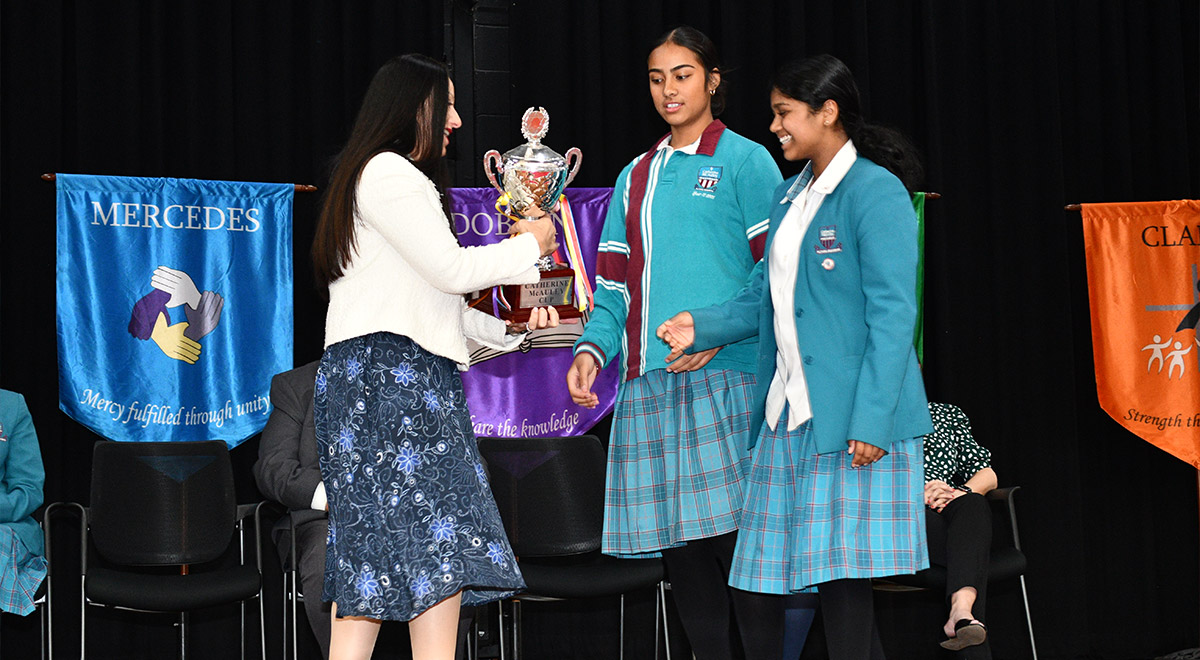  Dobson House Leaders Teresa M. and Shanelle W. being presented the House Cup by Principal Ms M. Refalo.