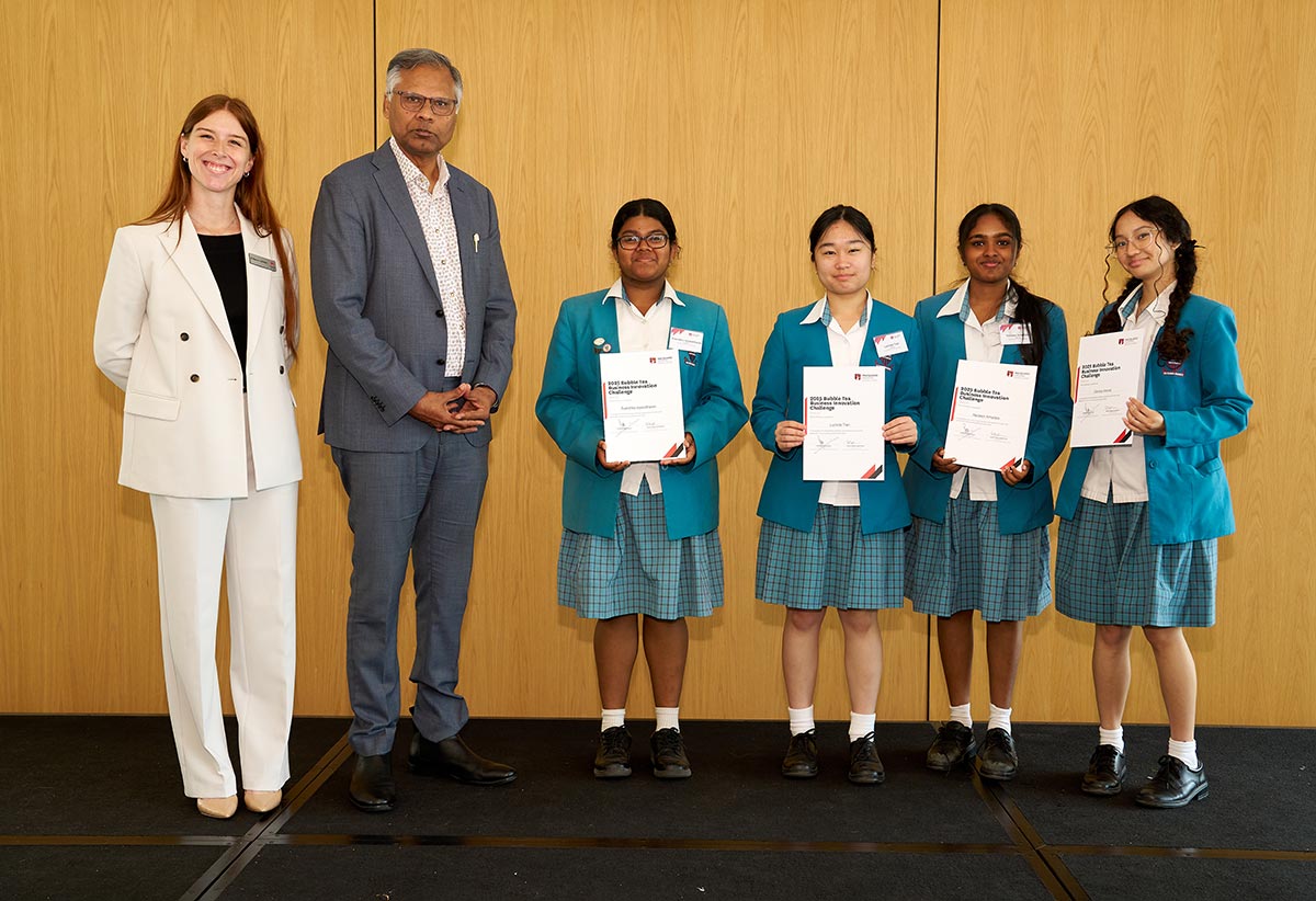Students from Team Sweet Set with Macquarie University representatives.