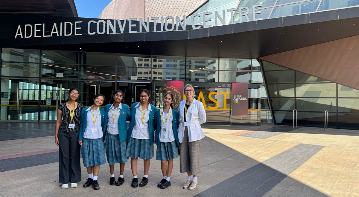 Ms L. Nagawkar and Ms T. Hartman with students outside the Adelaide Convention Centre.