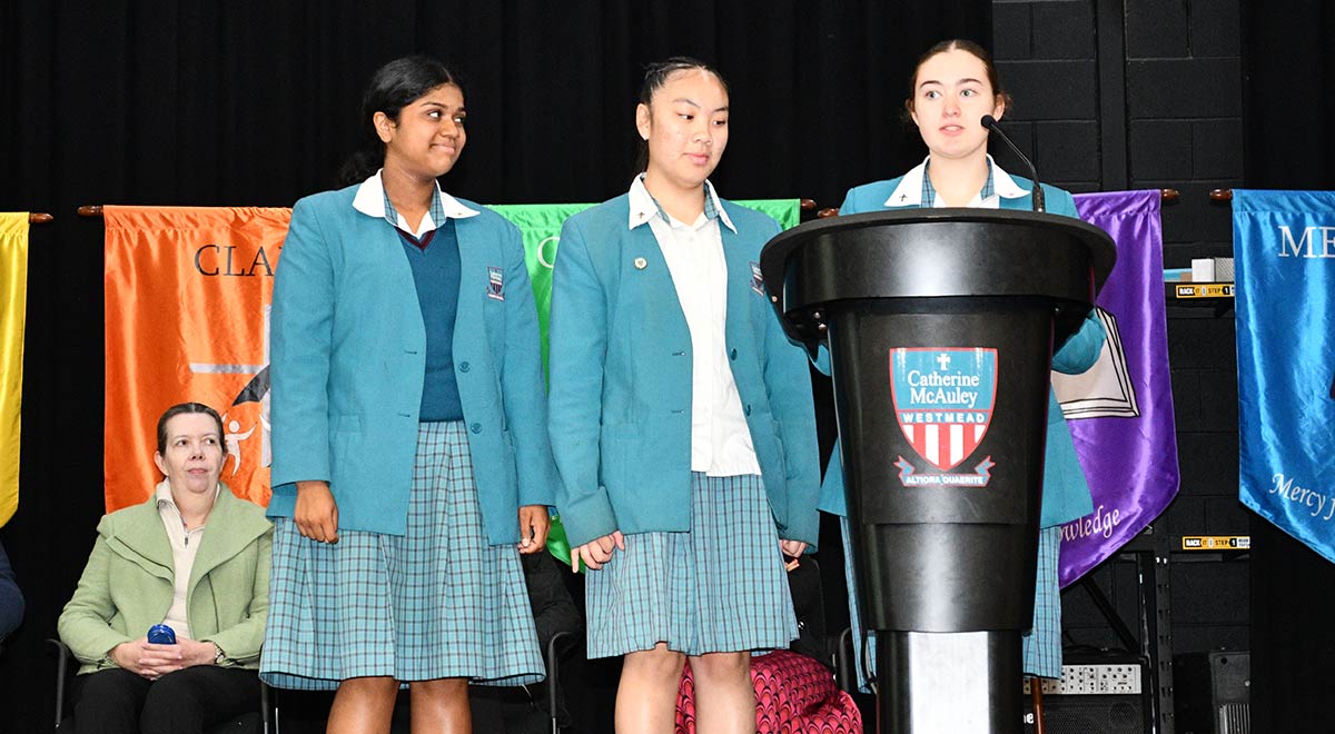 Shanelle W., Alyssa R. T. and Samantha J., Dobson, Coolock and Clare House Leaders, speaking at the school assembly on Wednesday 29th October 2025.