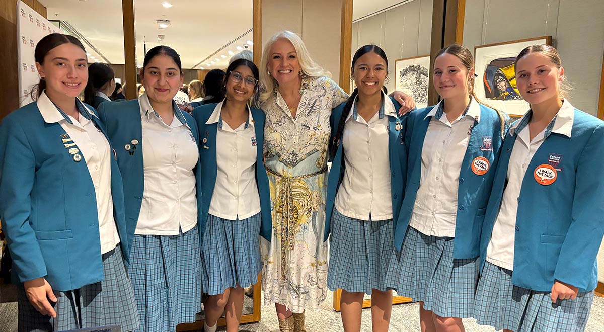 Dannielle Miller OAM, Director of Education, Women’s Community Shelters and ex-student of Catherine McAuley, with Year 10 students who attended the awards ceremony.
