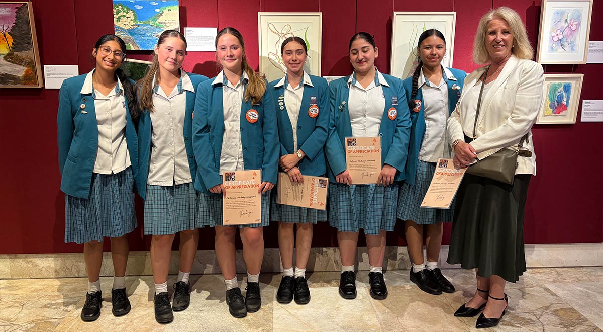 Dannielle Miller OAM, Director of Education, Women’s Community Shelters and ex-student of Catherine McAuley, with Year 10 students who attended the awards ceremony.