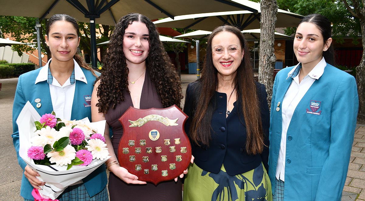 Dux of 2025, Niamh M. with Principal Mary Refalo and Captains