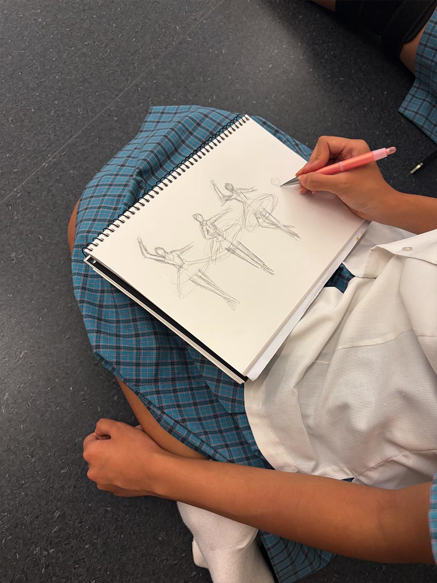 Year 10 Visual Arts students sketching the dance students