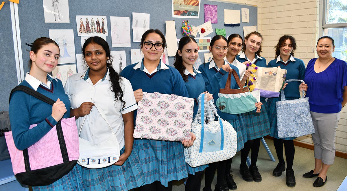 Year 11 Textiles and Design students with the bags they designed and constructed.