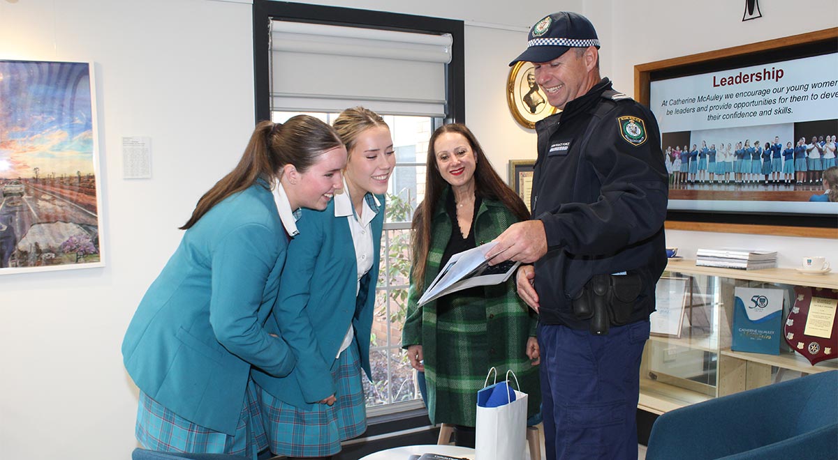 Principal, students, and Police Liason in school office